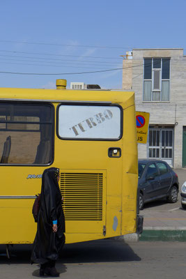 In buses men are sitting in the front part, women in the back.