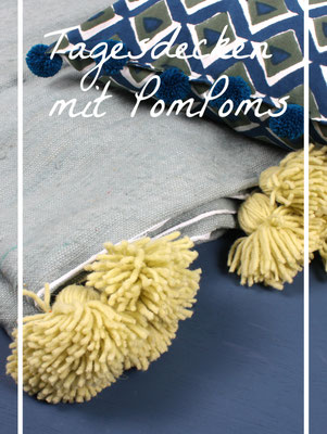 Plaids aus Wolle und Baumwolle mit Bommeln