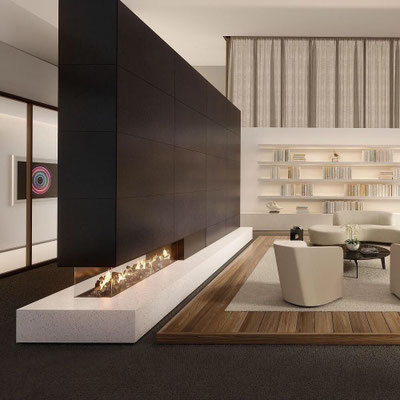 Black and white Sodostone fireplace functioning as dividing wall