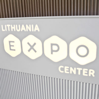 Expo counter with translucent logo made from white solid surface 