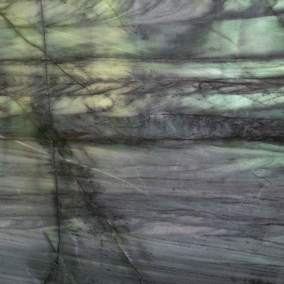 Decorative wall from translucent green and blue stone