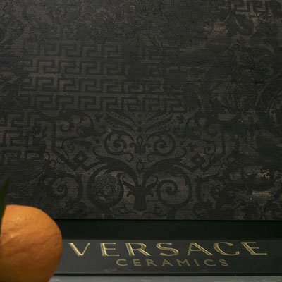 Ceramic wall from grey Versace tiles