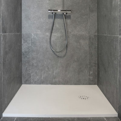 Wide adjustible shower pad from white Corian