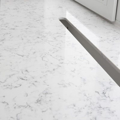 White and grey windowsill continuing into bar from Silestone Lyra engineered stone