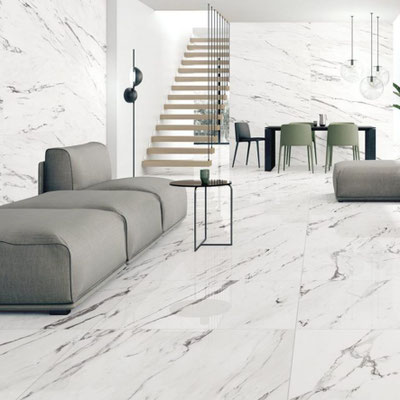 Luxurious home interior with walls and floor clad in white marble slabs