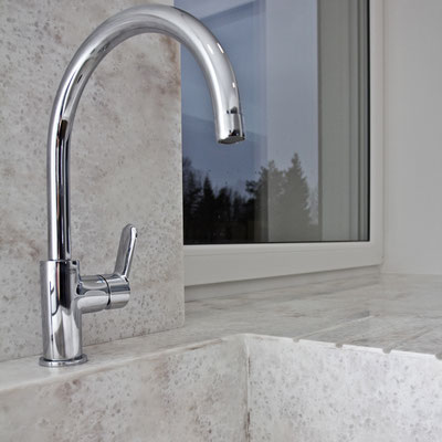 Kitchen sink, countertop, splashback and windowsill from solid surface, all joined together without visible seams / fabricator: Gforma