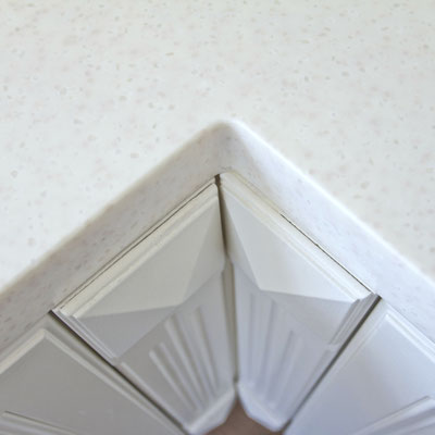 Acrylic solid surface panels are joined together without seams