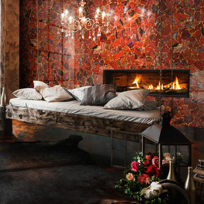 Decorative wall with integrated fireplace fabricated from Red Jasper gemstone 