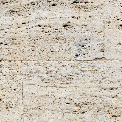 House facade built from travertine blocks