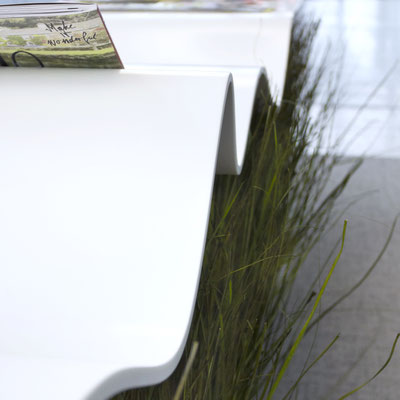 Wavy table for presentations fabricated from Corian solid surface