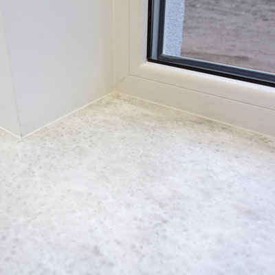 Windowsill continuing into worktop from Corian solid surface 