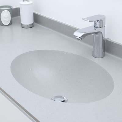Grey solid surface countertop with integrated oval sink / fabricator: Gforma
