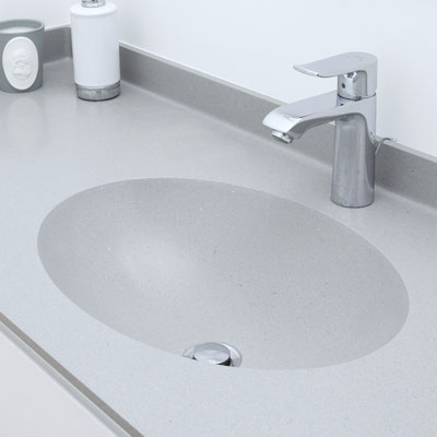 Grey solid surface countertop with integrated oval sink