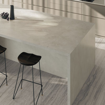 Cream-colored kitchen island fabricated from Dekton sintered stone