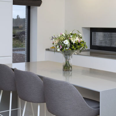 Kitchen island fabricated from Grey solid surface Corian 