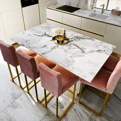 Dining table topped with Dover White Leather marble 
