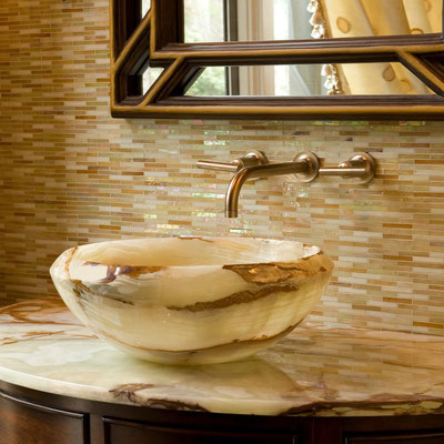 Exotic bathroom vanity with its top and washbasin sculpted from natural alabaster stone 