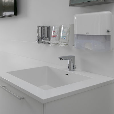 Medical washbasin in a clinic fabricated from white acrylic stone