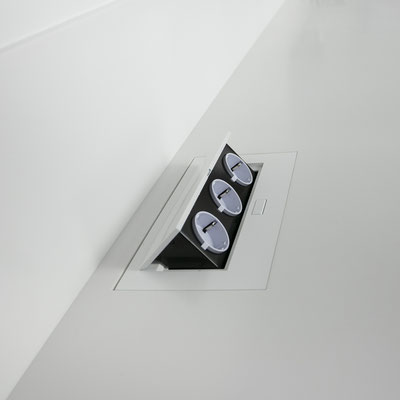 Electricity socket block integrated into solid surface worktop at a medical clinic