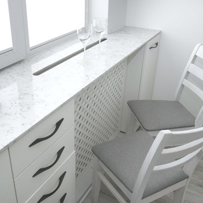 Engineered quartz windowsill with a long opening for warm air circulation from the heater 