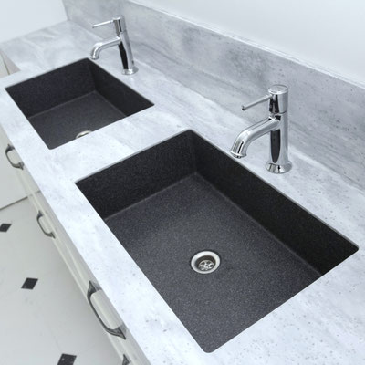 Grey bathroom vanity with two black integrated sinks fabricated from Corian solid surface 