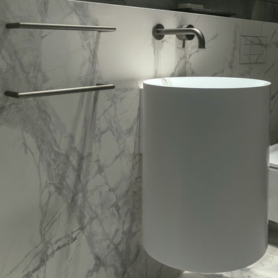 Round conic washbasin from acrylic solid surface hanging on a restaurant WC wall / fabricator: Gforma