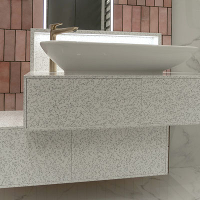 Bathroom vanity fabricated from Mosaic Dalmatian solid surface 
