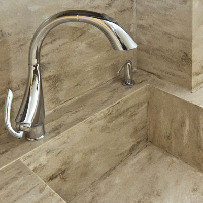 Kitchen sink with a splashback fabricated from Corian solid surface and integrated into worktop 
