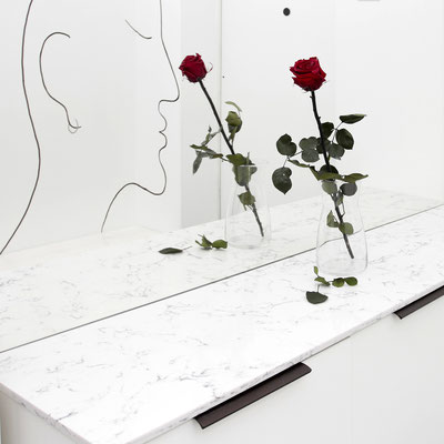 Console table topped with white and grey engineered stone 