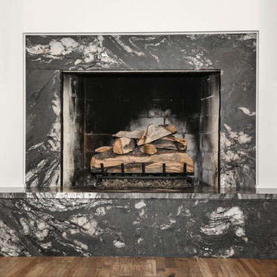 Fireplace decoration from granite in black and cream colors