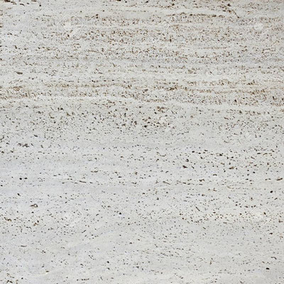 Natural travertine holes in slabs are often filled with transparent sealers by manufacturers