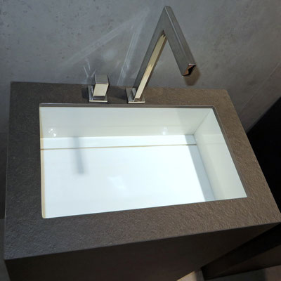 Two-colored self standing washbasin fabricated from Neolith sintered stone 