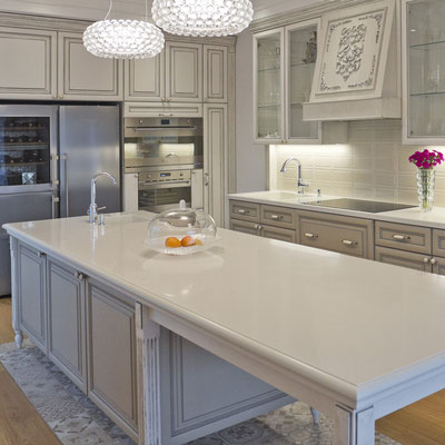 Kitchen island continuing into dining table topped with grey Corian / fabricator - Gforma