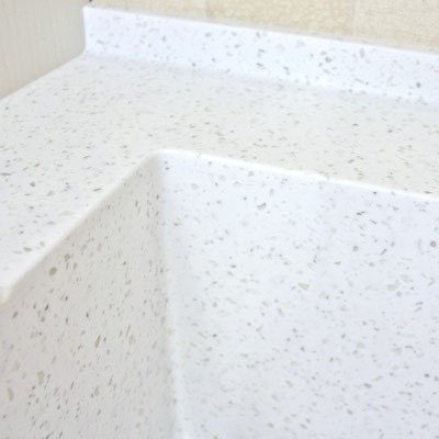The invisible solid surface countertop joints with integrated sink and curb / fabricator: Gforma