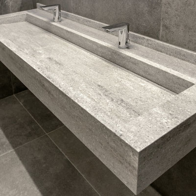 Hanging double vanity at a public Business Centre WC fabricated from Corian / fabricator: Gforma