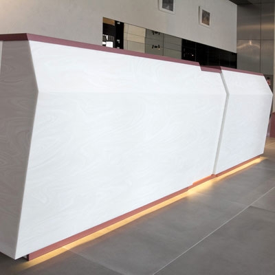 Business centre reception fabricated from acrylic stone Corian Onyx 