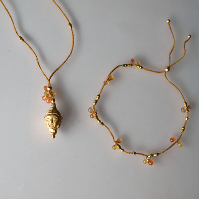 Buddhakopf 750er Gold, orangefarbige Saphire