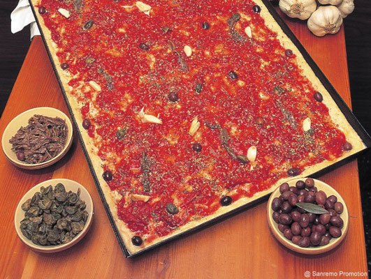 Sardenaira, a typical local kind of pizza, made with tomato, garlic, olives and anchovies