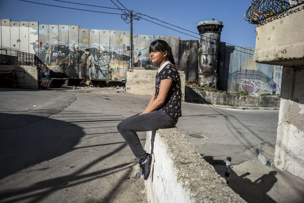 Rowaida, 16 years old, just beside the separation wall - The Youngsters of Aida Camp, Bethlehem, Palestine © François Struzik - simply human 2018