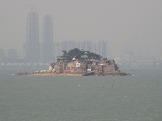 Taiwanese island and mainland China in the background