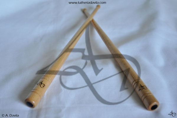 Drumsticks in maple with rings in blackwood.