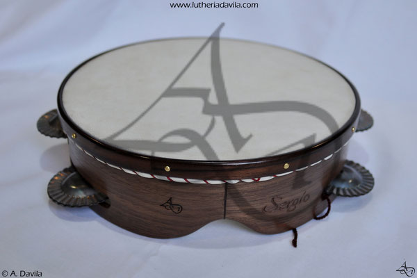 Walnut tambourine with rosewood ring of 9 pairs of hardened jingles