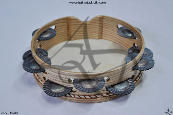 Common ash tambourine with 9 pairs of hardened jingles.