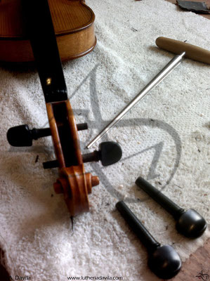 Change of pegs on violin.