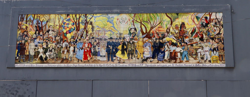 A famous painting made by Diego di Riviera on a wall in the middle of Mexico City
