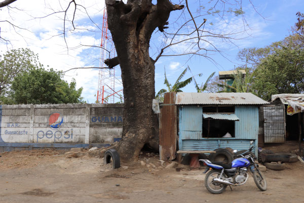 People living in tin shacks along side the road