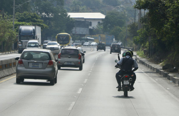 ...even on the roads people carry their guns on the back of a motorbike - after a long civil war they have a large quantity of weapons in the country