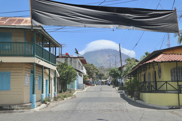 Off the ferry and into to the streets of Moyogalpa with the cloud covered Volcan Concepcion in the distance