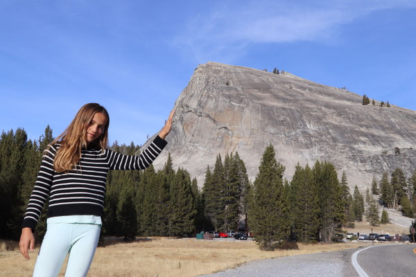 Lynn leaning on Lambert Dome in Yosemite National Park