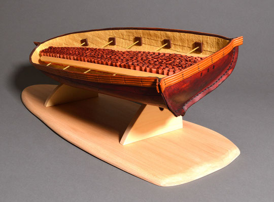 Adrift (2017) cuir bouilli formed leather, crinkled pastepaper, Lokta Metallic Gold paper, wood, brass rod, linen thread, 20 x 7.5 x 4.5 inches, Art Museum of Greater Lafayette